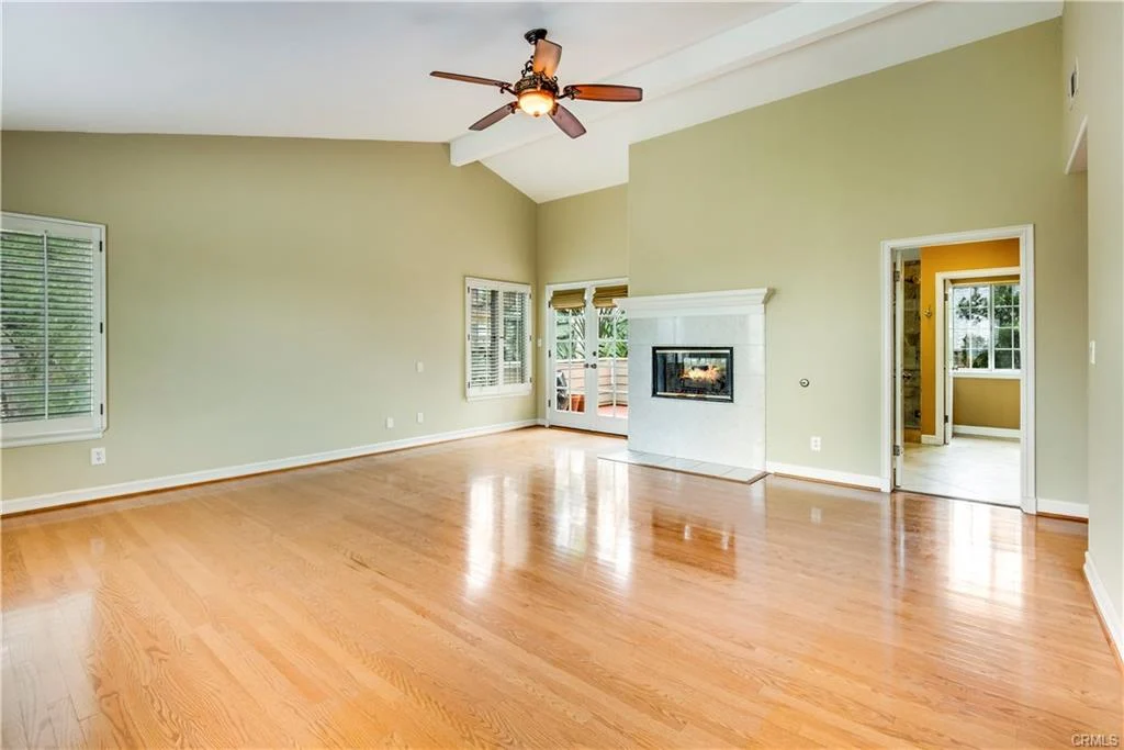 Large living room with fireplace and windows