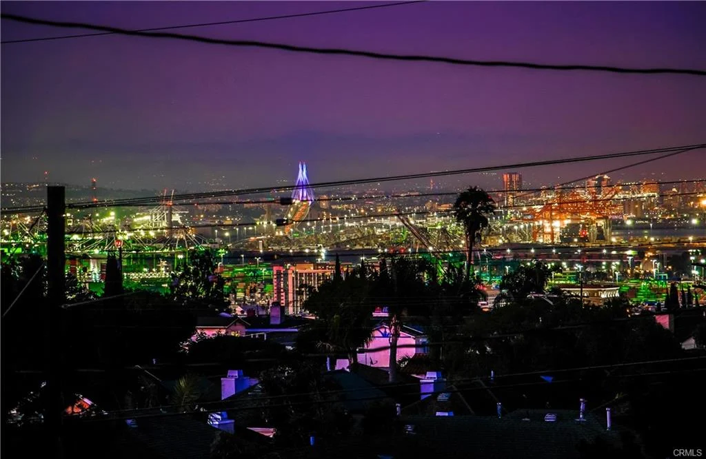 Cityscape with buildings, lights, and power lines