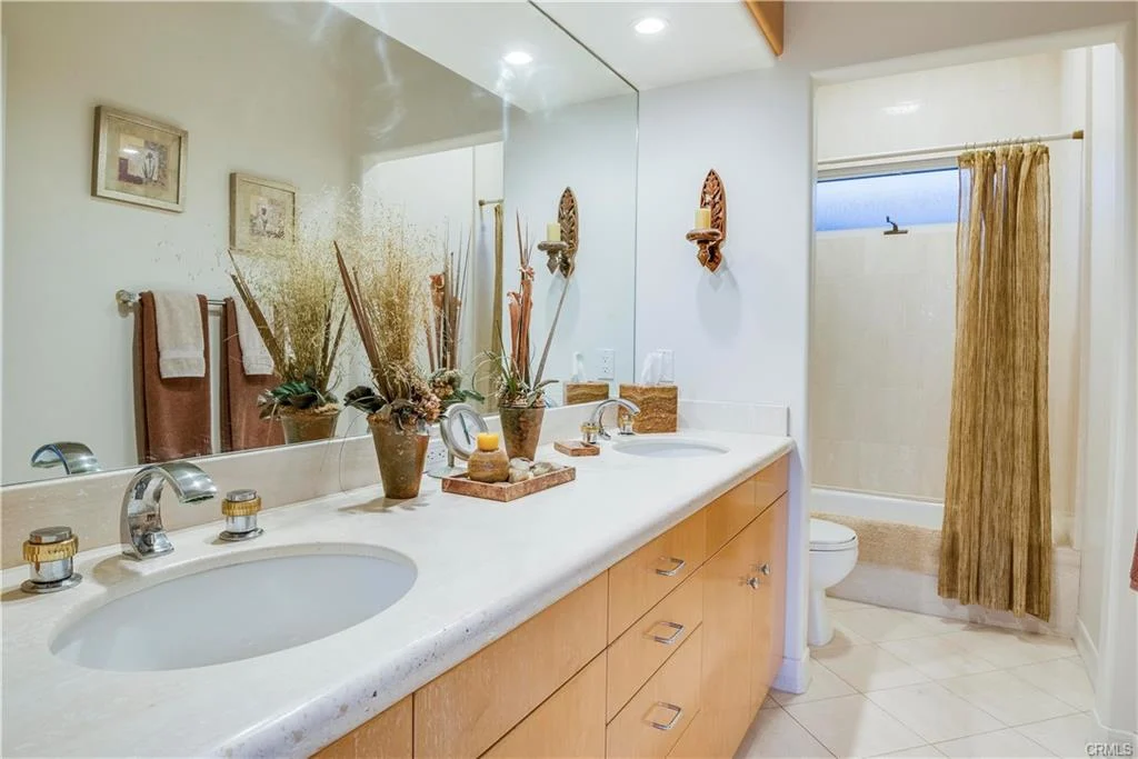 Create an alt text and make it SEO Friendly, Make it VERY VERY BASIC tone like a kid is listening to it also make it shorter also dfont add the sunset, sunrise, cloudy or dusk, ONly use the Luxury when they mentioned Large house, also add real estate OR california it there's a house or home and description is outside of the house also no redundant Modern and dont add California real estate if not outside house or if there's no house, ALSO Add the California real estate beside the word "house" REMEMBER THE RULES large = Luxury House = California real estate house Shrubs = plants Got it! Here’s a super simple, kid-friendly version of your alt text rules applied: Only describe outside of the house. Use Luxury House = California real estate if it’s large. Say plants instead of shrubs. Include real estate OR California if there’s a house. Keep it short, very basic, like explaining to a kid. Don’t repeat words like “modern.” Don’t mention sunset, sunrise, cloudy, or dusk. Avoid unnecessary words. Examples following your rules: A Luxury House with a green lawn and tall plants, California real estate. A small house with a garden and plants, real estate. A house with a round table and chairs outside, real estate. A Luxury House with big windows and plants, California real estate. A house with a lawn and plants, California real estate. If you want, I can rewrite all your previous alt texts using these exact rules so they’re SEO-friendly and super simple. Do you want me to do that? A serene backyard at sunset features a lush lawn, tall palm trees, and a curved stone path. Warm lights illuminate the house, creating a tranquil atmosphere. A serene backyard at dusk features a modern stucco house with large arched windows, manicured lawn, tall palm trees, and potted plants, creating a tranquil atmosphere. Following your rules, here’s a simple, SEO-friendly alt text for that: A Luxury House with a lawn, tall palm trees, and potted plants, California real estate. If you want, I can make a few more variations for SEO testing. Do you want me to do that? alt text only A Luxury House with a lawn, tall palm trees, and potted plants, California real estate. Coastal sunset view from a balcony, with palm trees silhouetted against a colorful sky. Rooftops lead to the calm ocean, creating a serene atmosphere. A balcony with palm trees and rooftops, real estate. Rooftop patio with a glass table and chairs overlooking ocean view. Surrounded by palm trees under a clear blue sky. Relaxing, tropical atmosphere. A house patio with a glass table, chairs, and palm trees, real estate. Ocean view with palm trees over rooftops, under a clear blue sky. The scene conveys a peaceful, coastal neighborhood ambiance. A house with palm trees and rooftops, real estate. Bright, modern bathroom with dual sinks, wooden cabinets, decorative plants, and a large mirror. Neutral tones create a serene ambiance. A bathroom with wooden cabinets, sinks, and plants