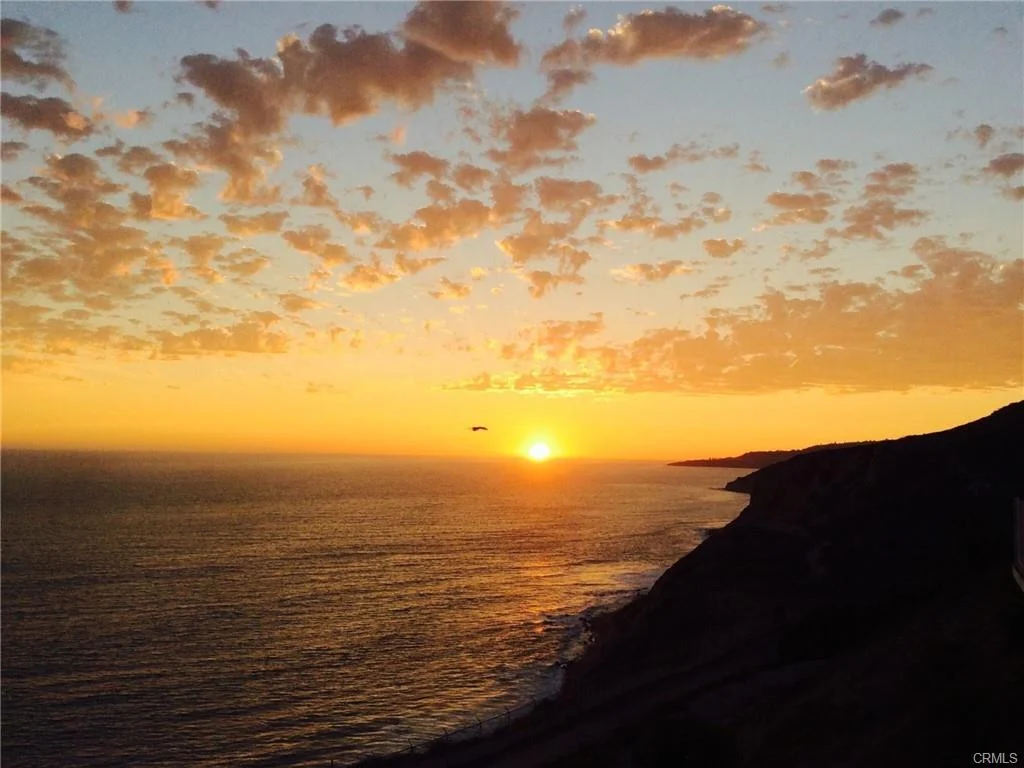 Ocean with orange and yellow sky