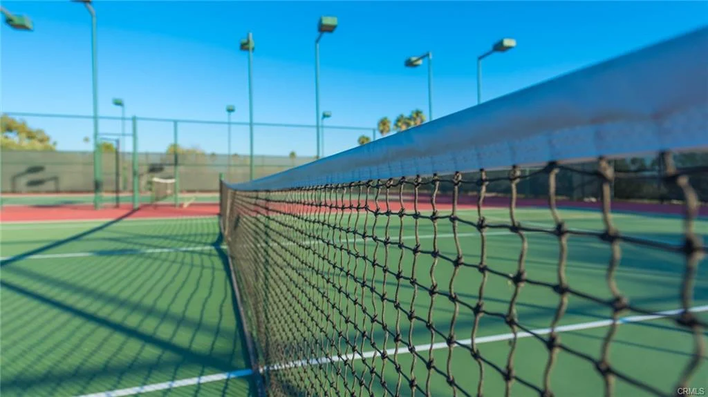 Tennis court with net, green floor