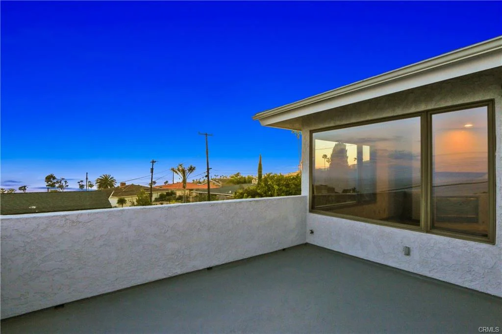 Balcony with view of coastal scenery.