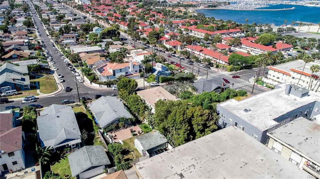Residential area with houses, streets, and ocean nearby