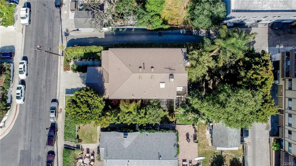 Residential neighborhood with houses, trees, and street