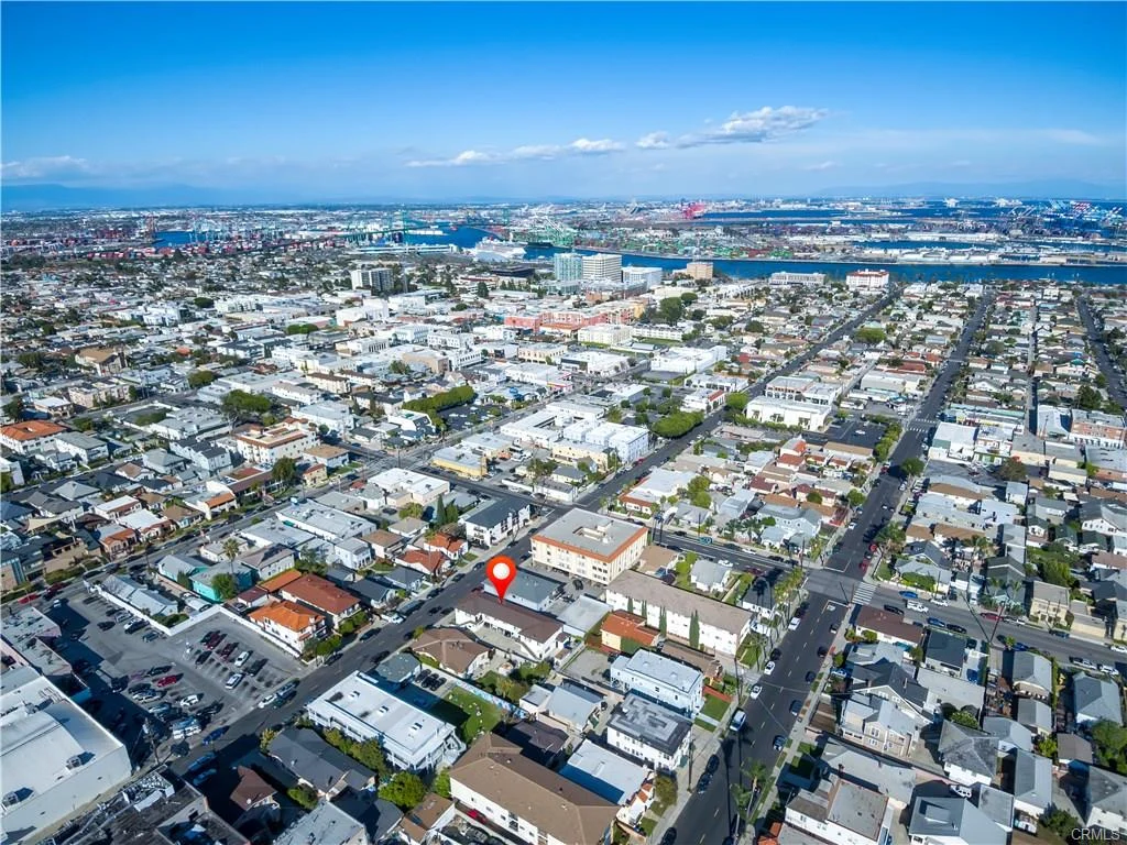 Aerial view of city with houses, streets, and buildings